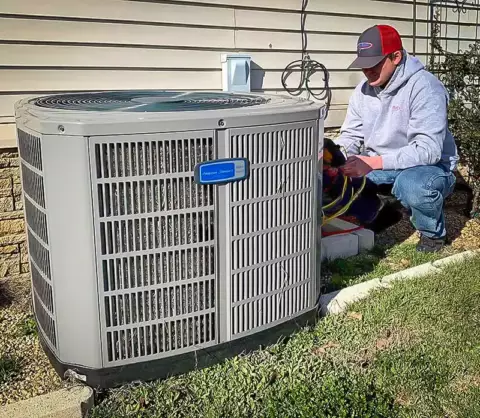 One of our experienced technicians working on an HVAC unit